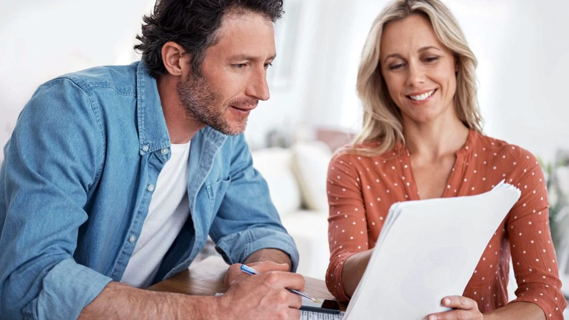 Couple reviewing income protection insurance documents from Protect Your Income in Kildare, Ireland