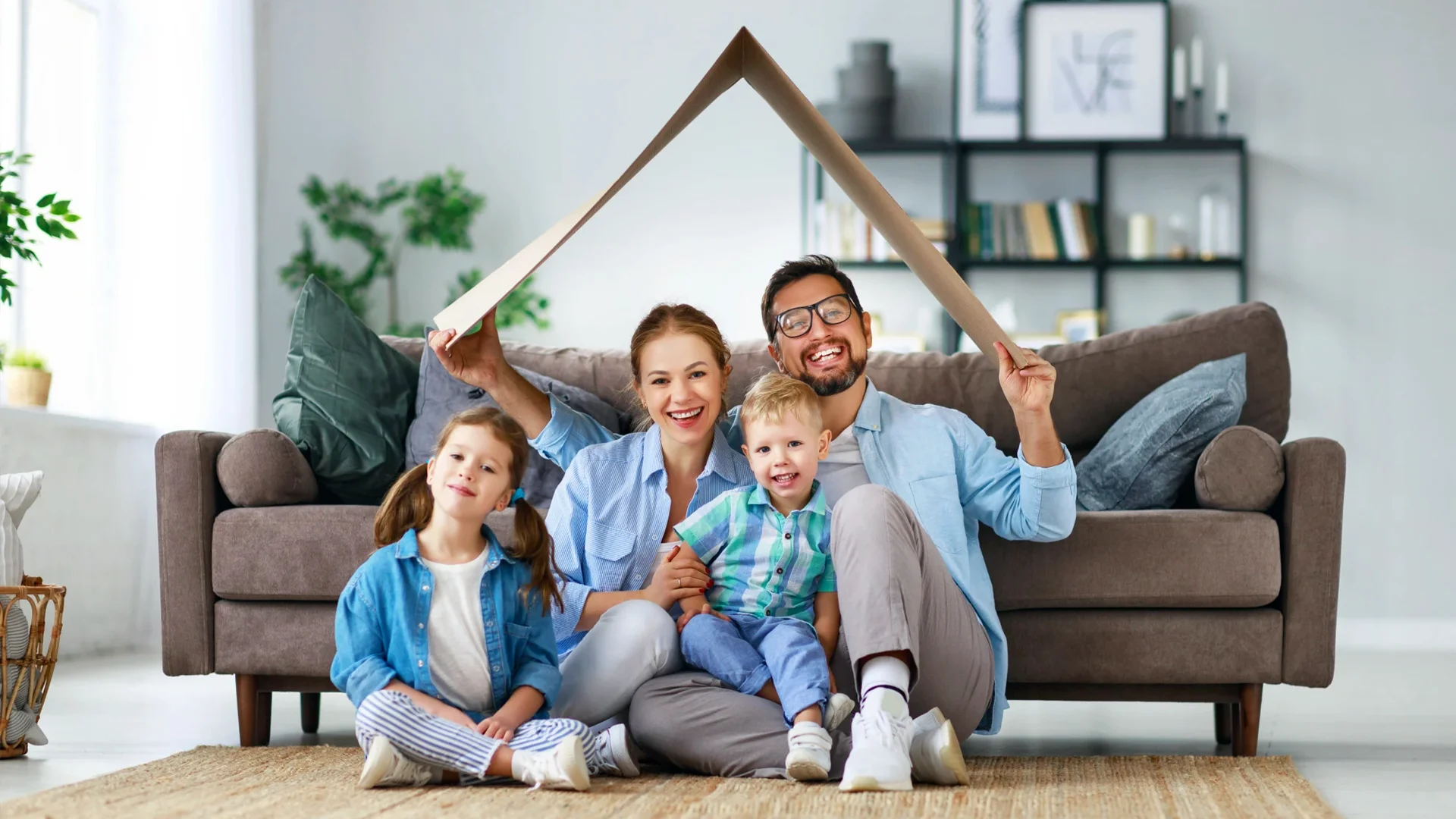 Happy Irish family enjoying financial security at home with income protection insurance in Ireland.