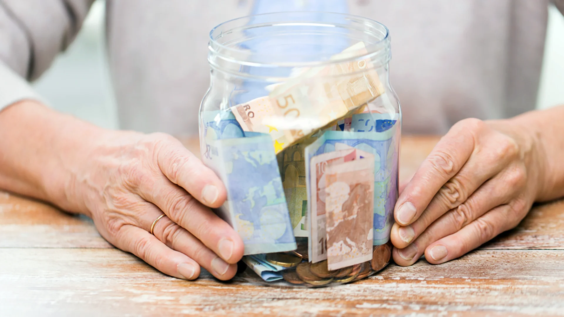 Jar of euro notes symbolizing tax relief benefits on income protection insurance in Ireland, helping families save money.
